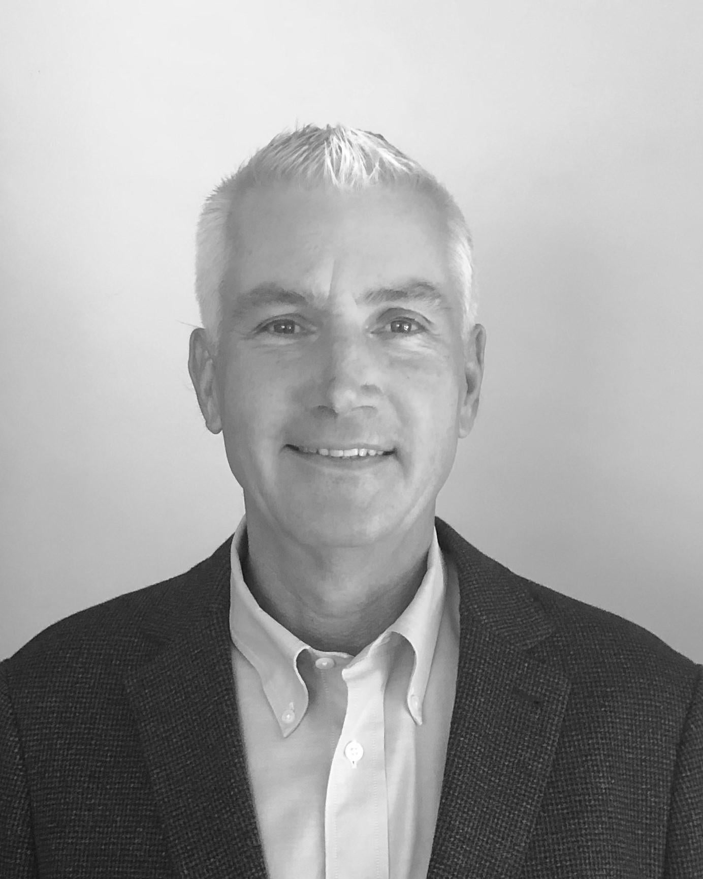 Black and white headshot of mortgage loan officer Tom Shewalter